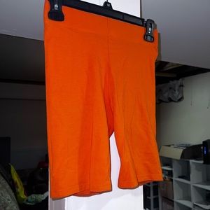Orange biker shorts- mid thigh